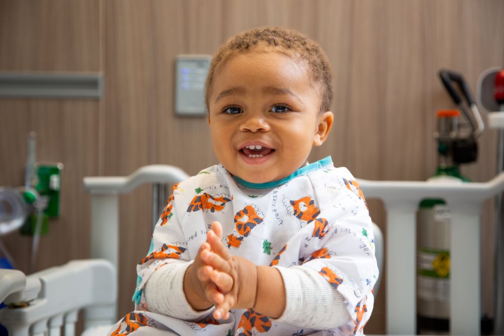 Smiling baby boy in hospital