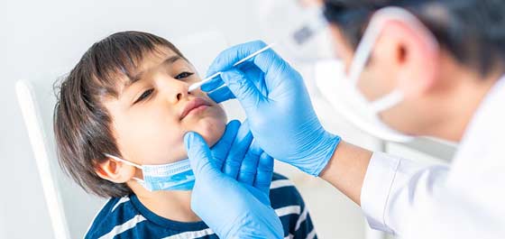 child receiving Covid test