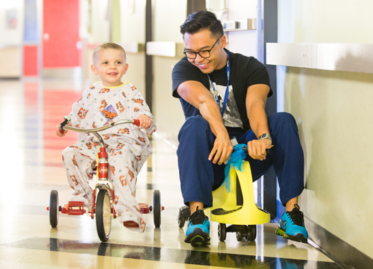 Aiden with a caregiver.