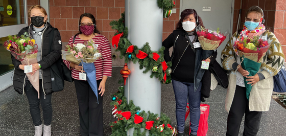 Community Ambassadors with flowers