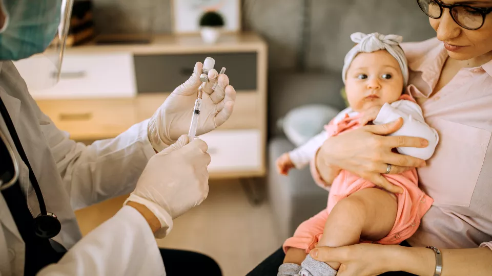 Baby about to receive a vaccine