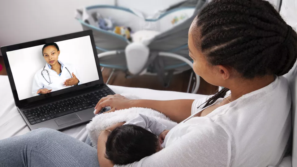 Mother and baby in a virtual urgent care visit